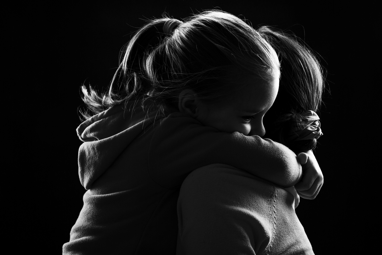 Little girl hugs her mother Deborah Todd Family Law Victoria