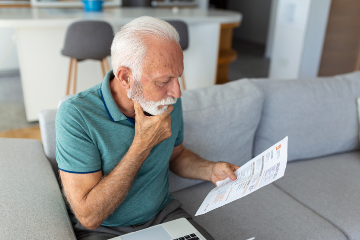 man reading paperwork