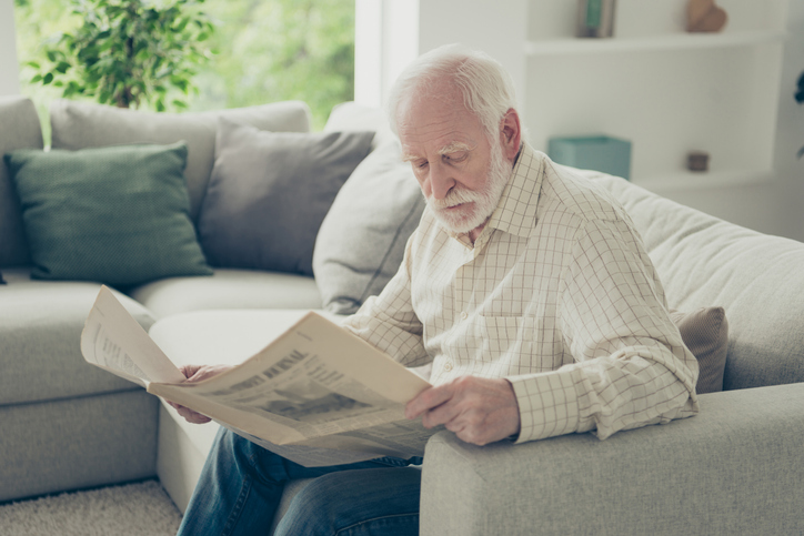 man reading paper