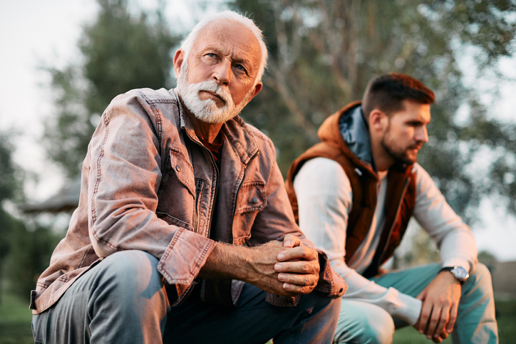two men sat outside